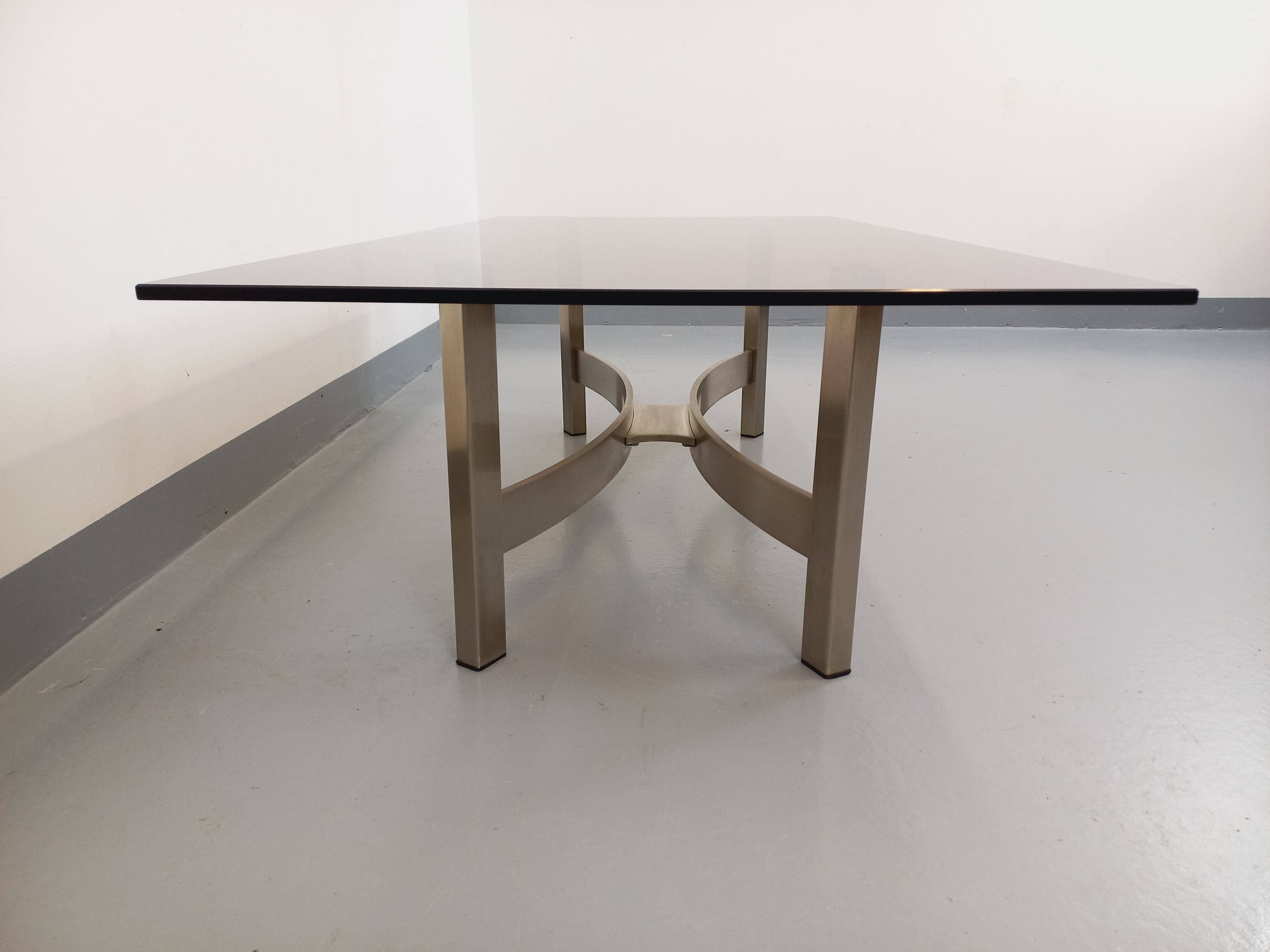 Vintage coffee table in smoked glass and brushed cast aluminum from the 70s