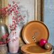 Four vintage glazed stoneware potter's plates