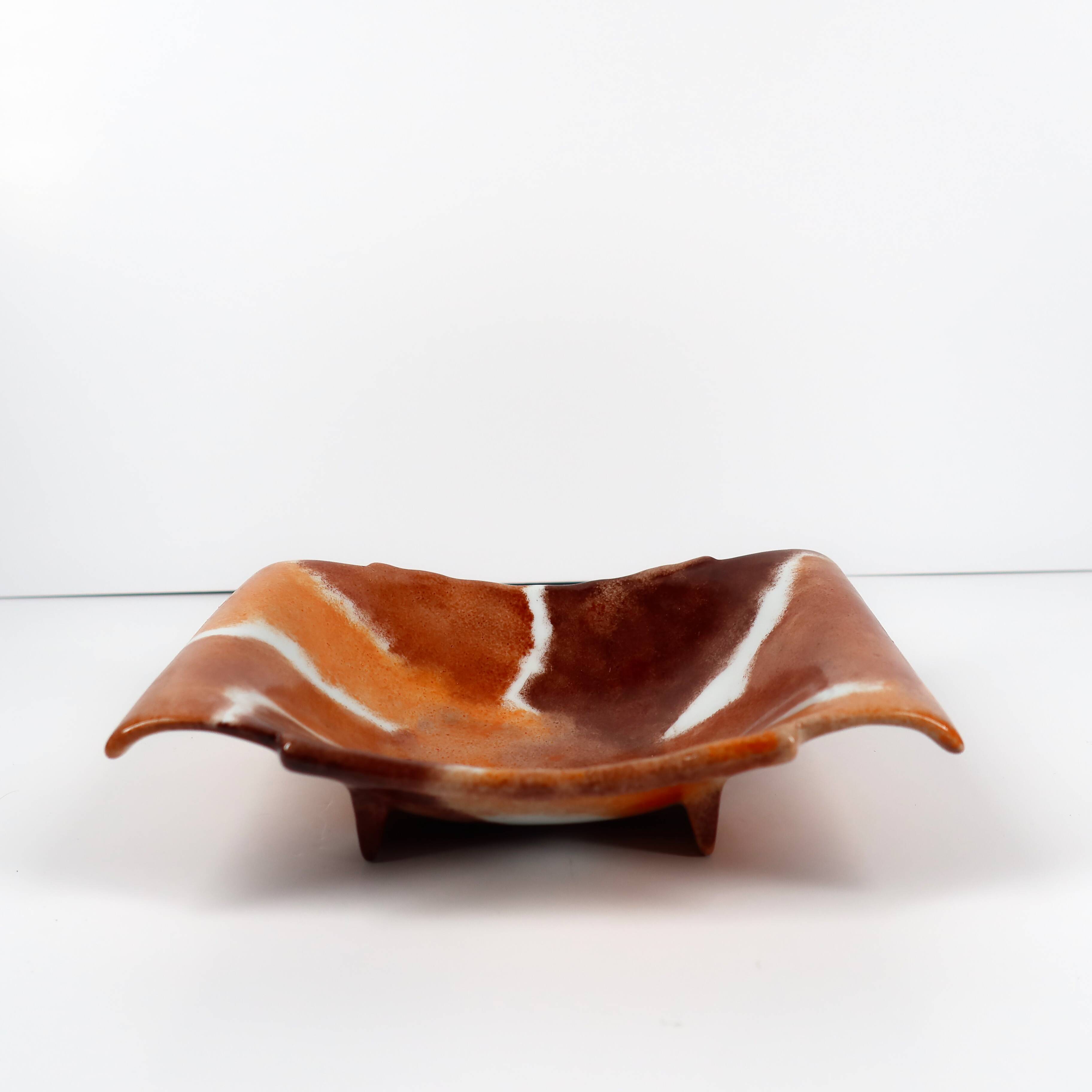 Handcrafted ceramic trinket dish in shades of brown and orange
