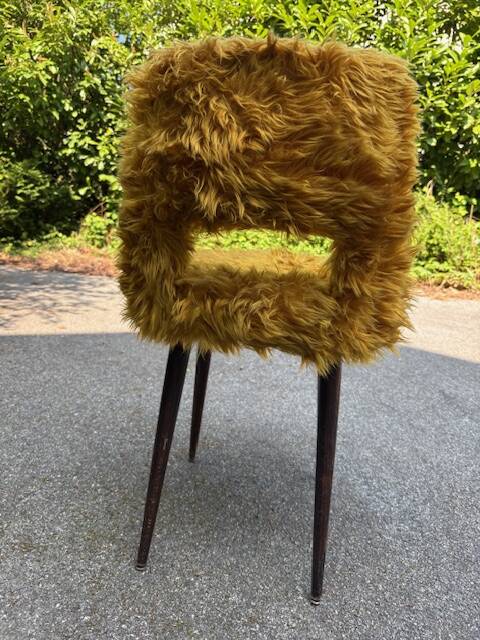 Old mustard furry armchair