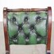 English Chesterfield office chair in green leather, height adjustable on casters