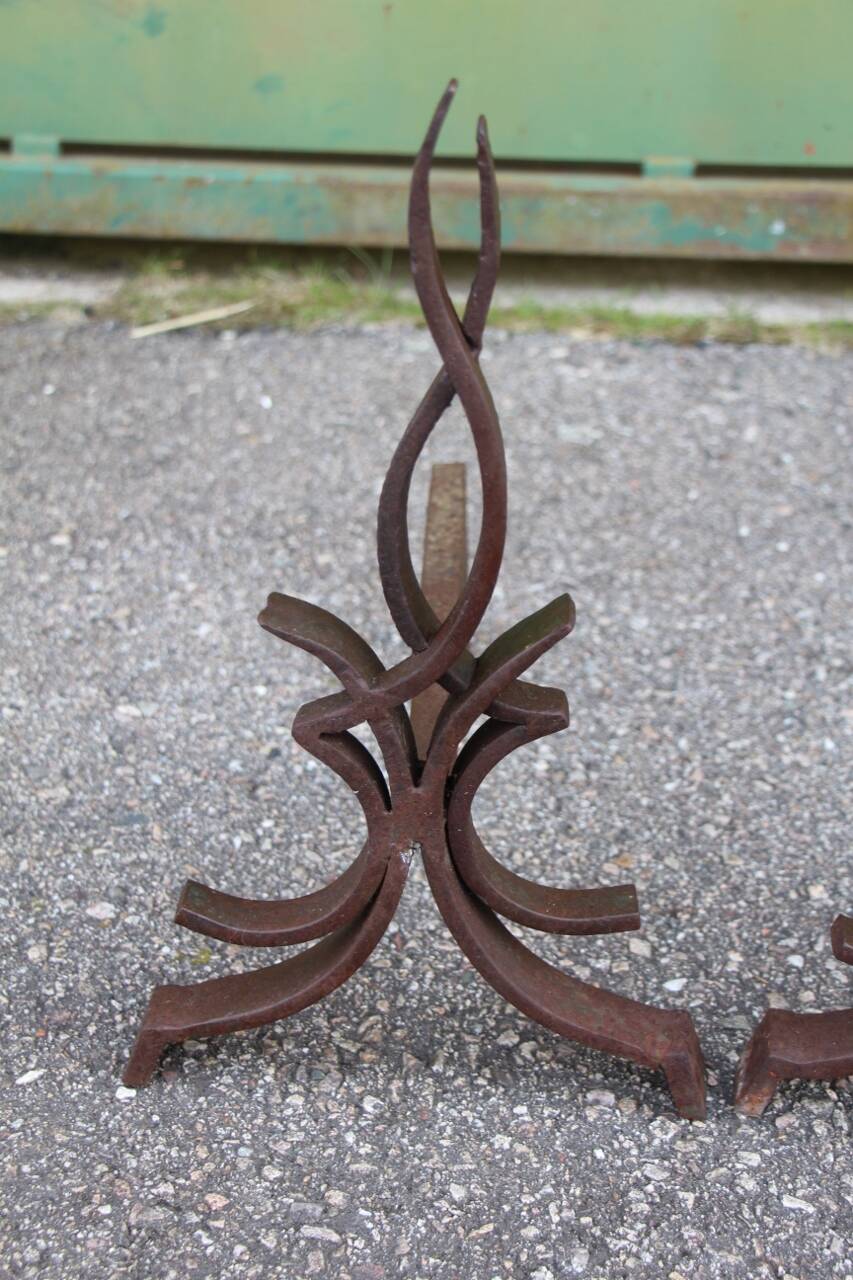 pair of andirons attributed to Raymond Subes, flame model