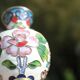 Two small vintage cloisonné enamel vases with Asian floral decoration.