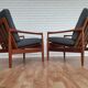 A pair of Danish armchairs, teak, wool, leather