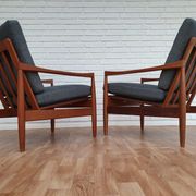 A pair of Danish armchairs, teak, wool, leather