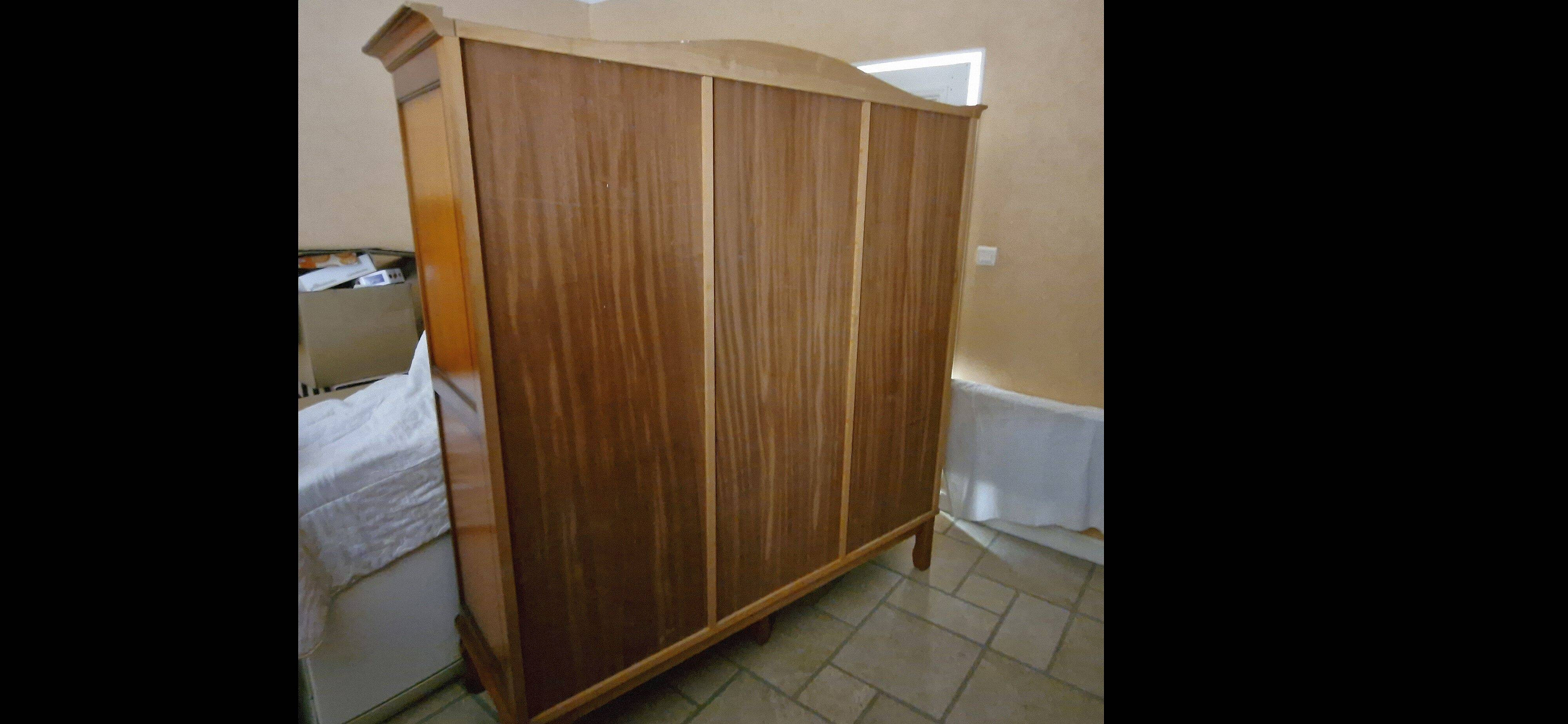 Wooden style wardrobe, 3 doors and 9 internal shelves.
