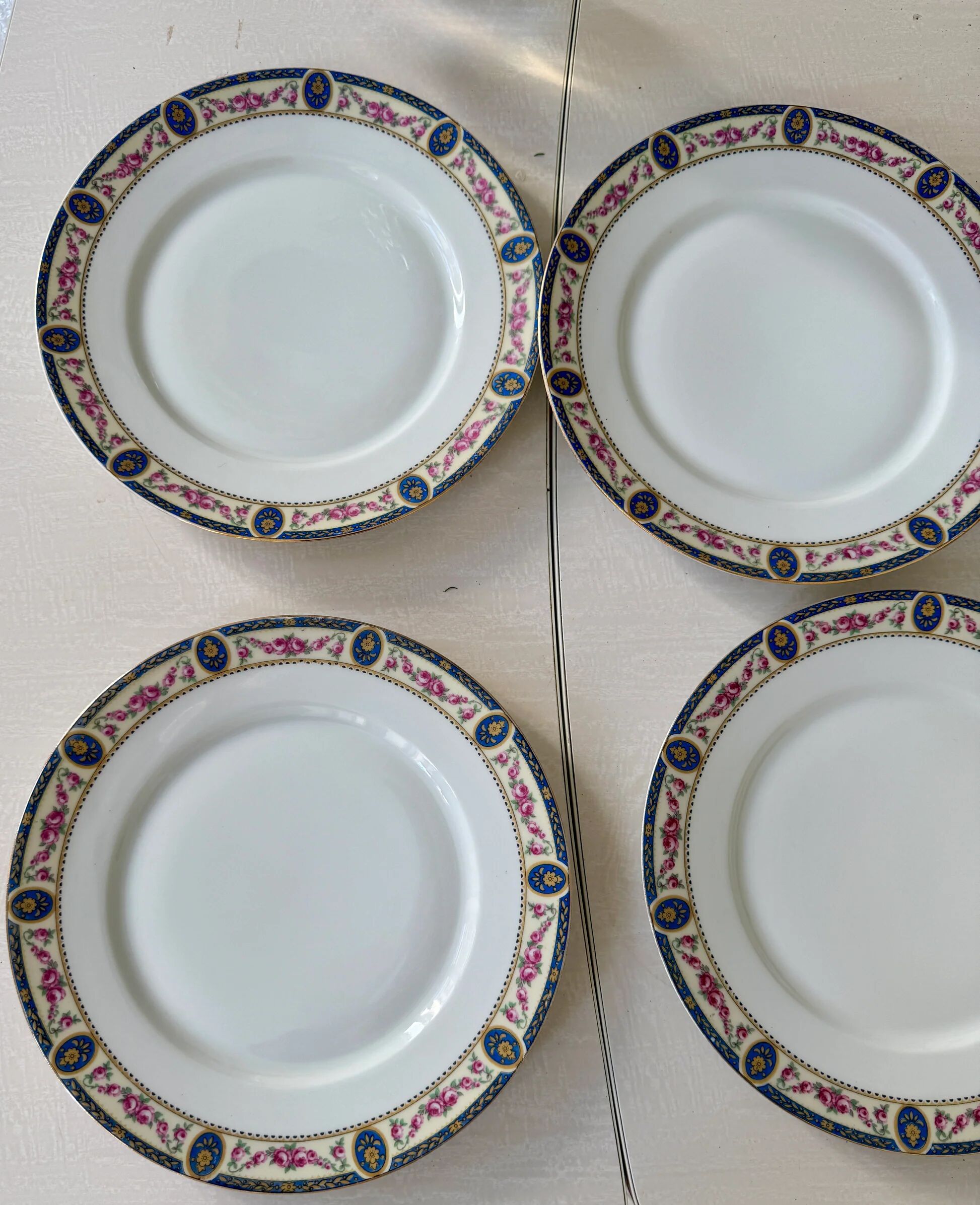 Set of 7 flat plates in Limoges porcelain