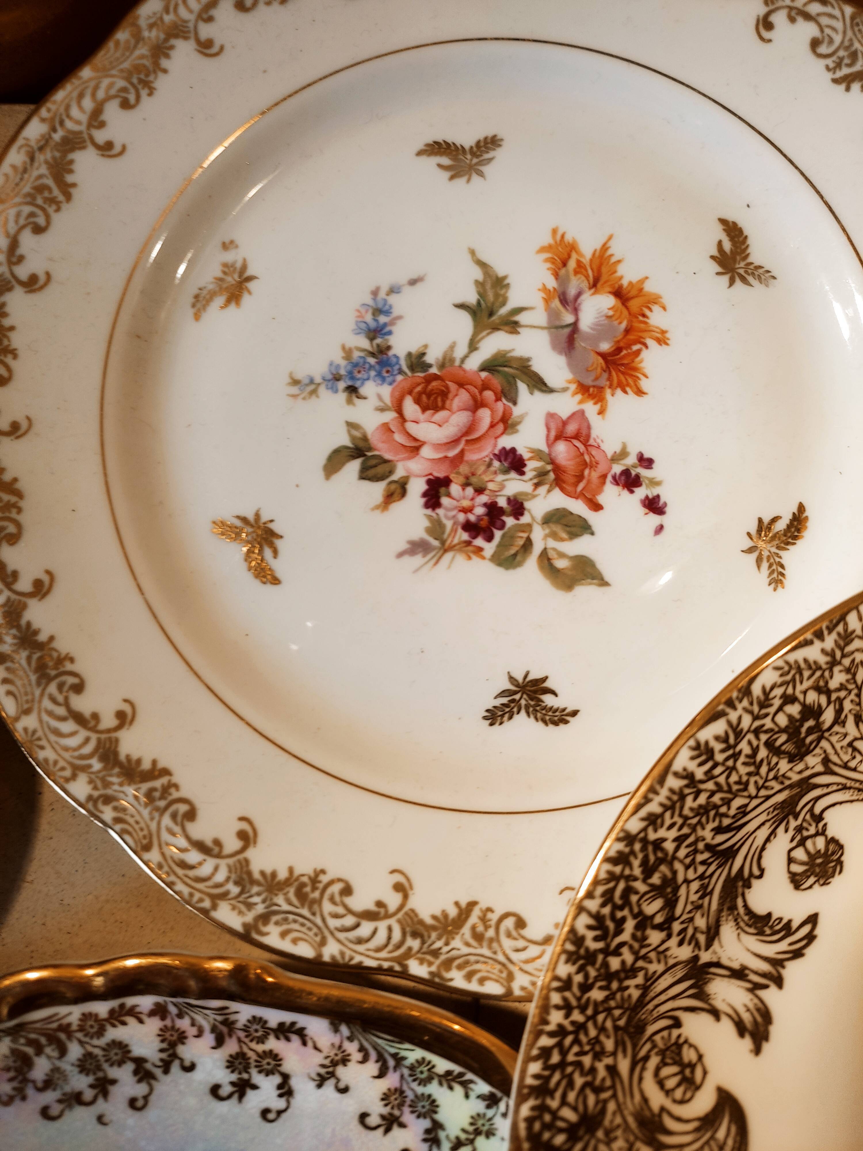 6 mismatched dessert plates decorated with roses