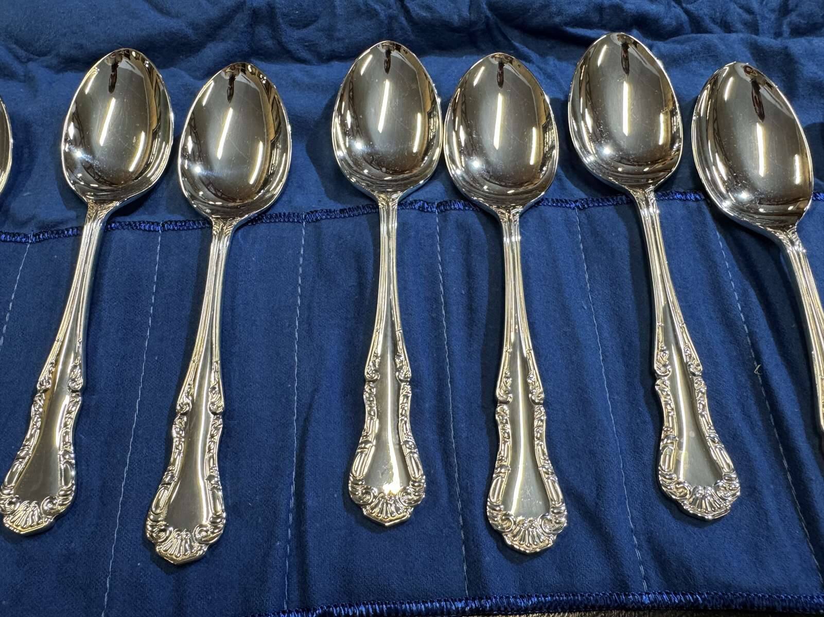 Set of 12 dessert spoons by Mappin and Webb in silver plate.