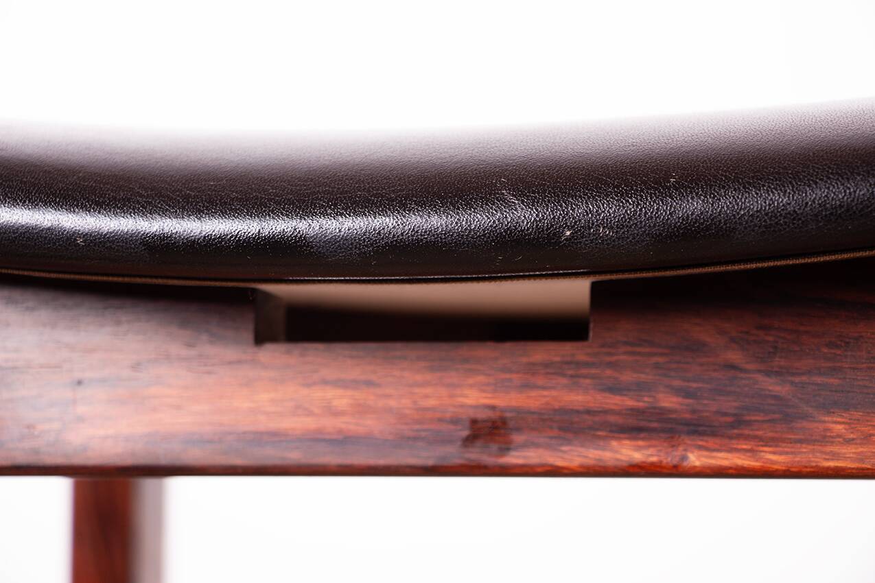 4 Danish high stools, rosewood and black leather, Knud Bent for Dyrlund.