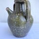 Ancient oil jar in glazed terracotta, khaki green — Auvergne, Lezou