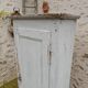 Old patinated bonnet maker