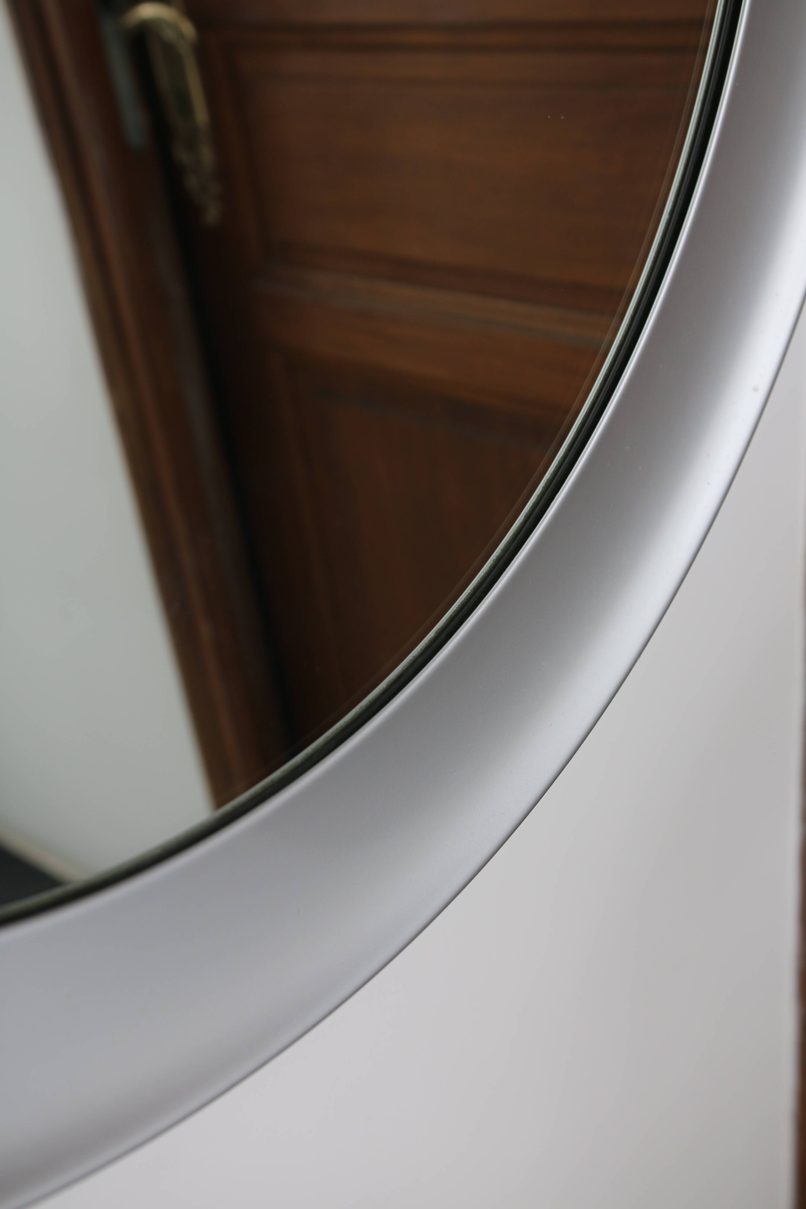 Large round brushed metal mirror by Sergio Mazza for Artemide, 1960s-70s.