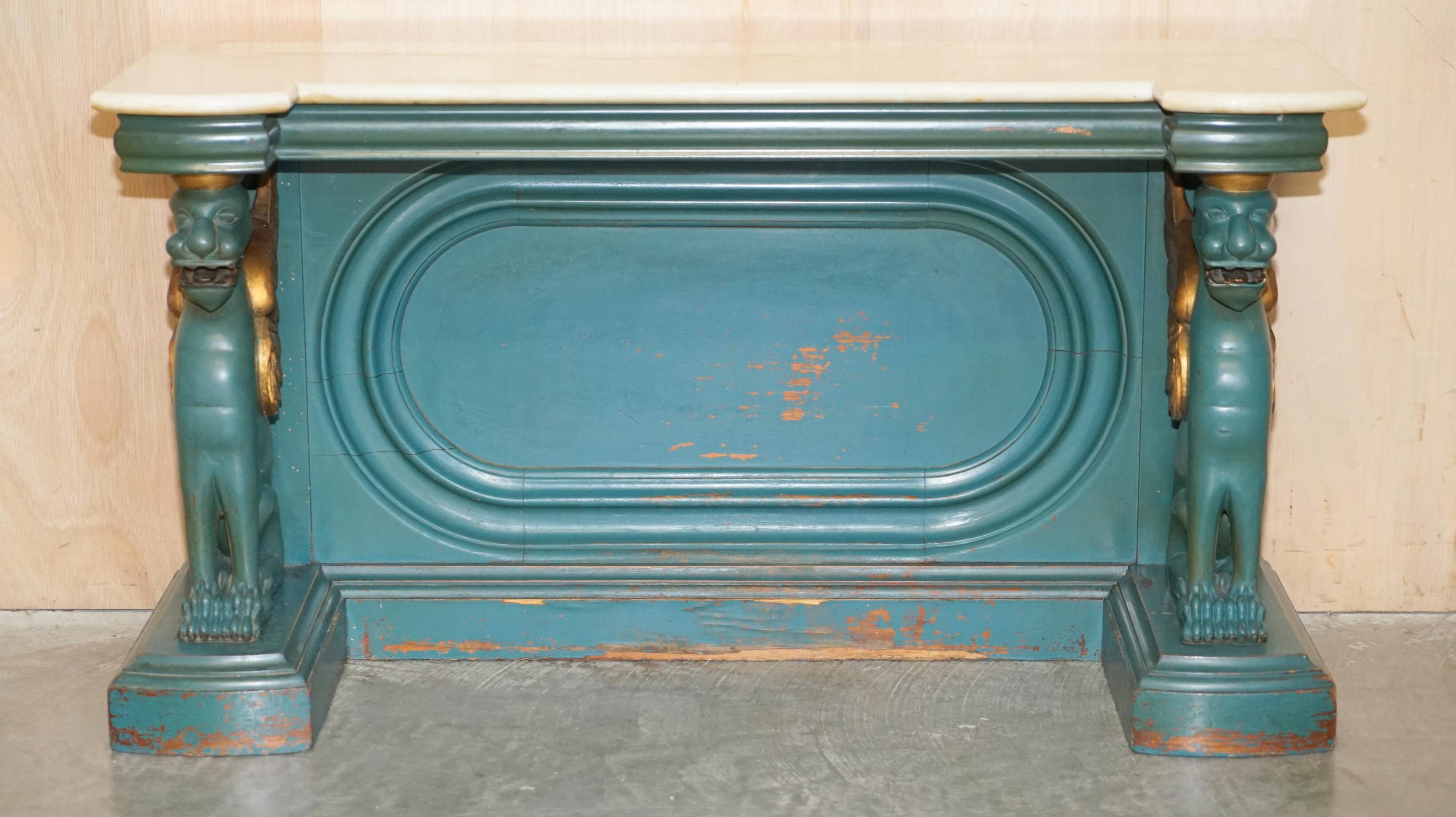 Antique hand-carved console circa 1880 with a marble top.