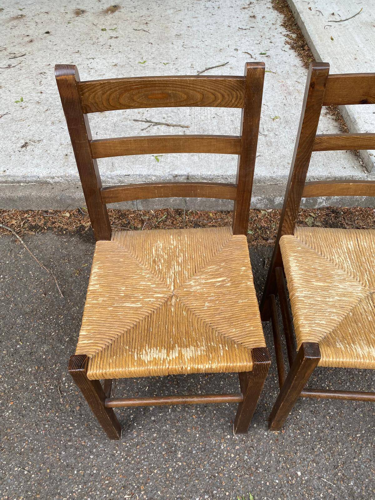 2 solid wood and straw chairs