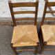 2 solid wood and straw chairs