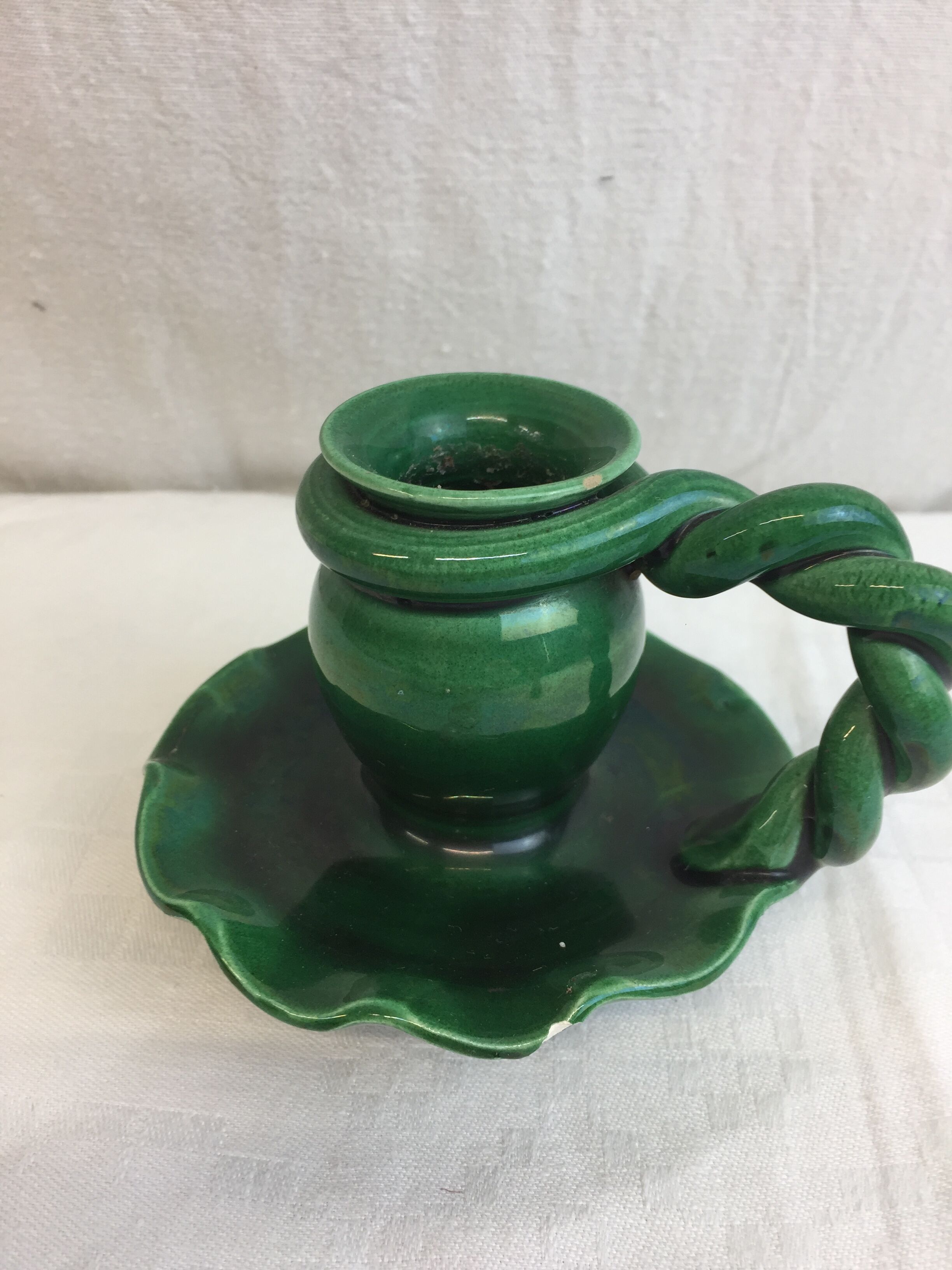 Old candleholder, glazed terracotta cellar, artisanal green color