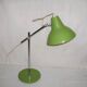 Green desk lamp with an arm from the 1970s.