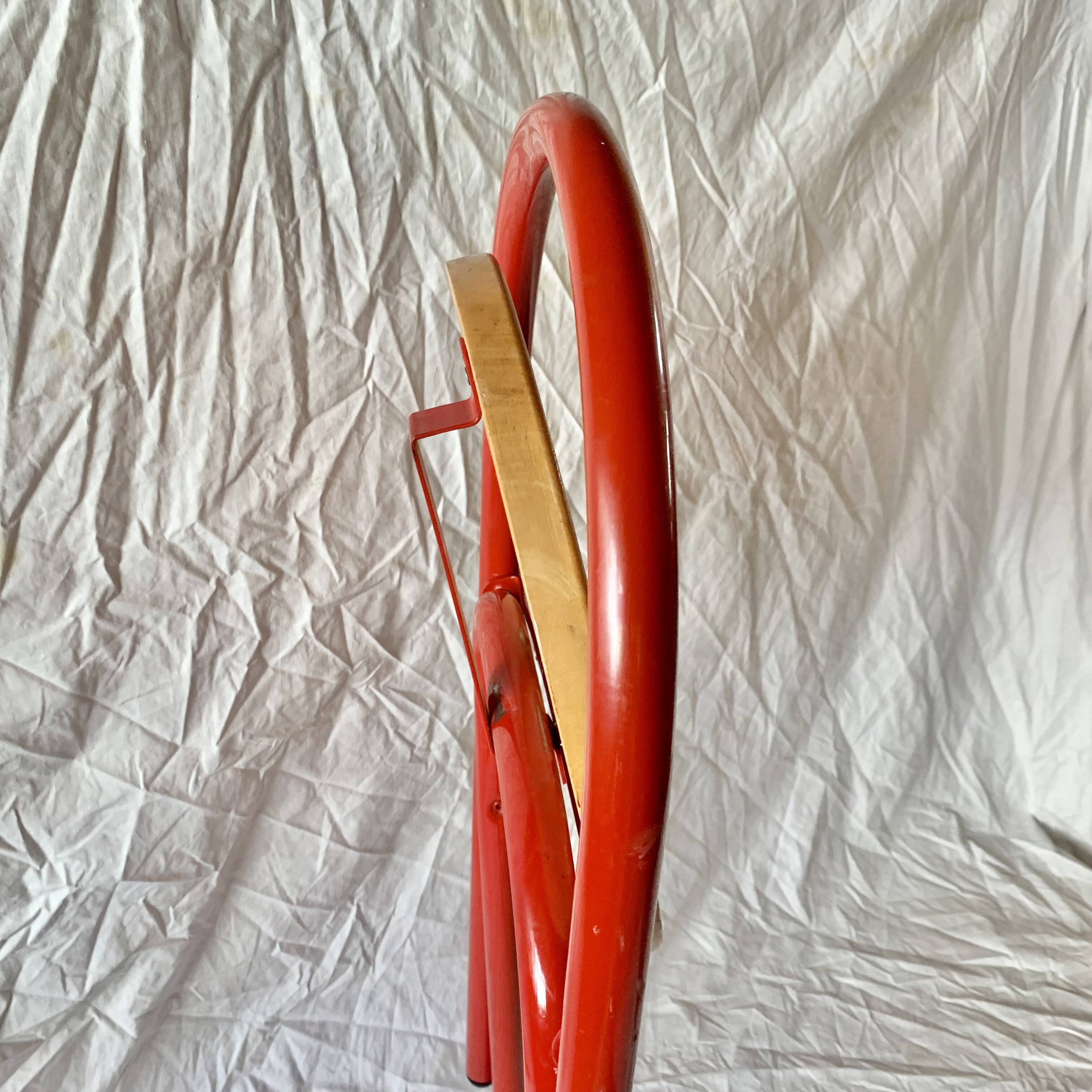 Vintage folding chair in red painted metal and wood
