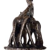 African stone sculpture of 3 Giraffes