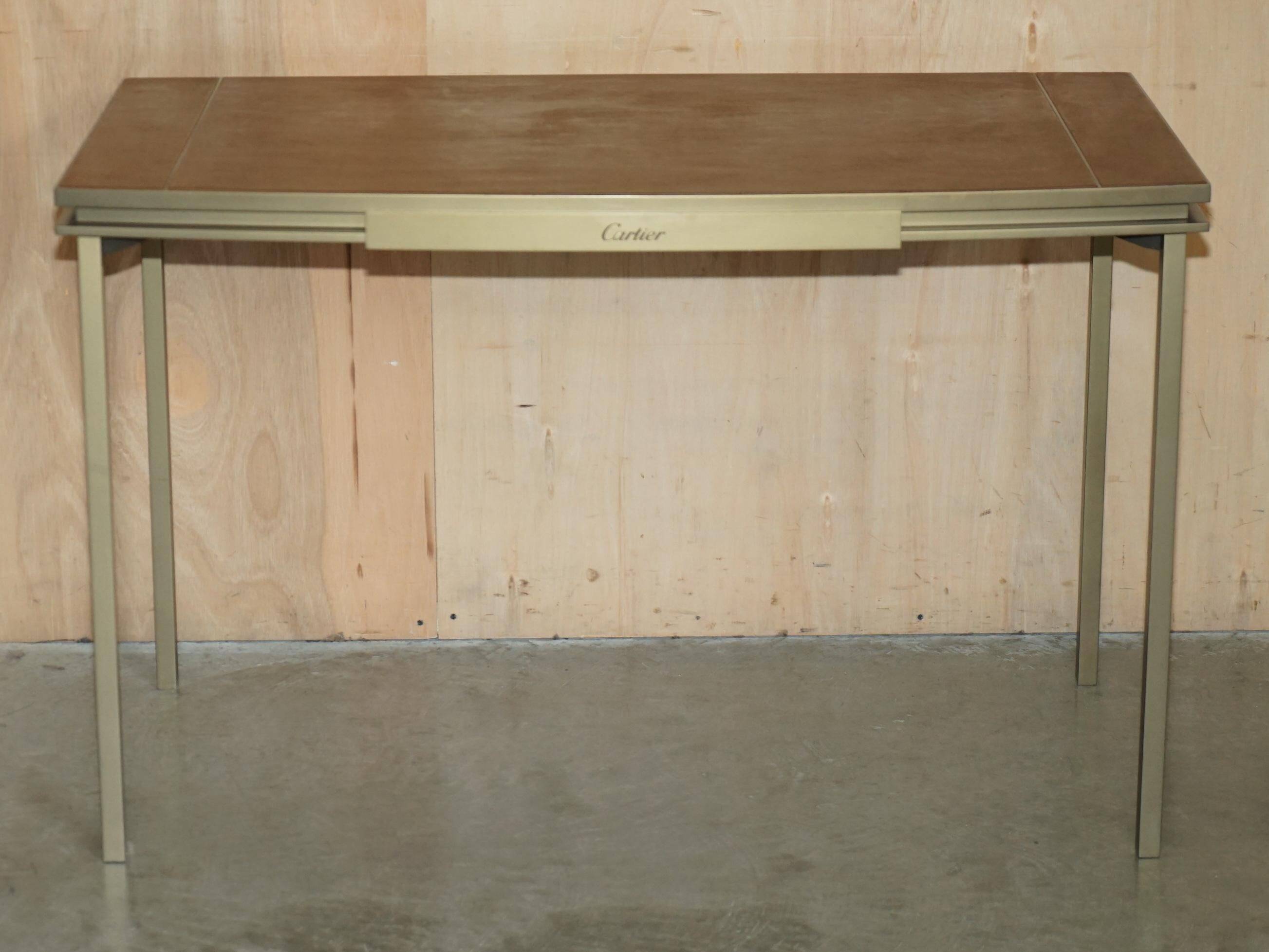 Modern mid-century writing desk signed Cartier in bronze and leather.