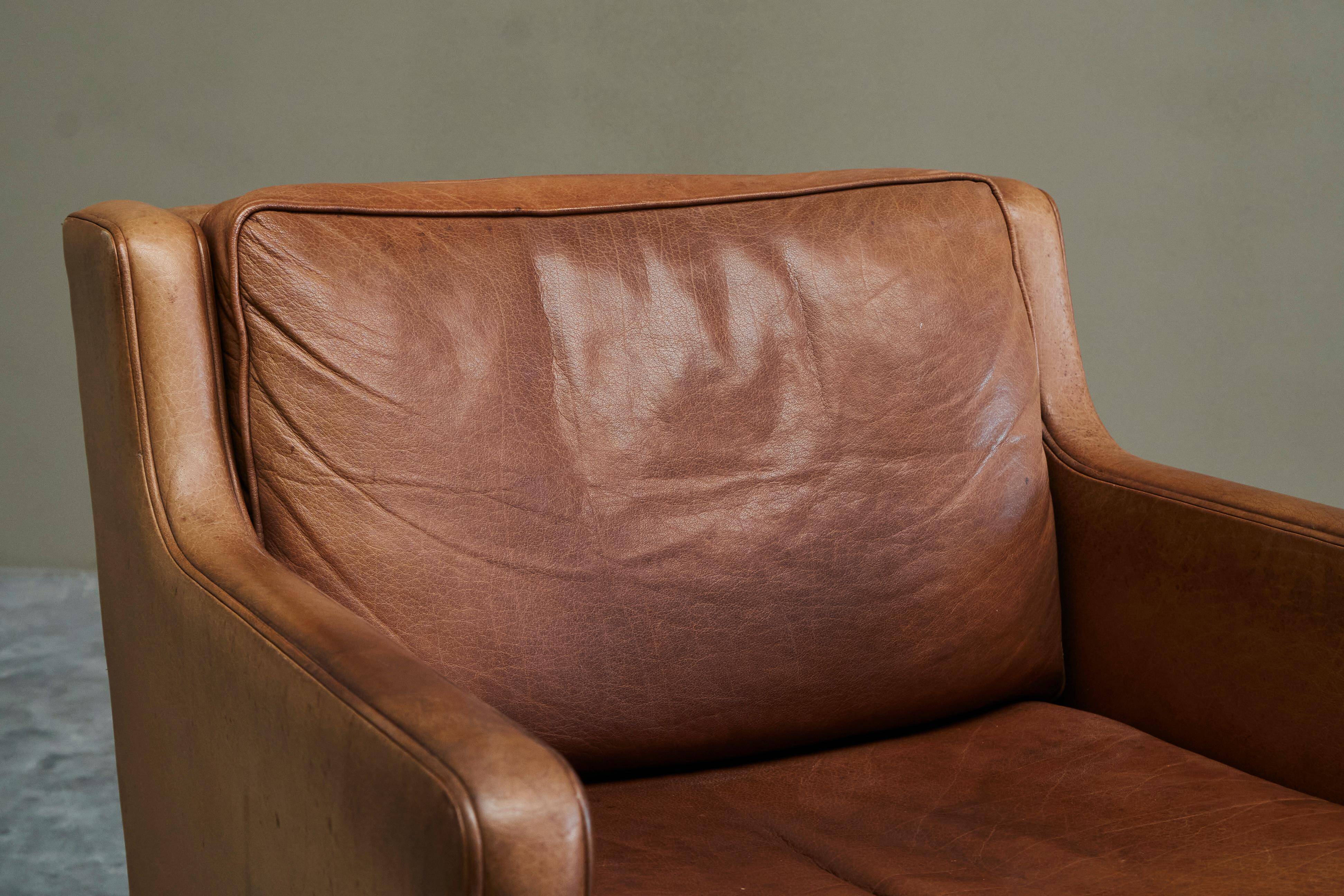 1970s patinated leather Scandinavian lounge chair