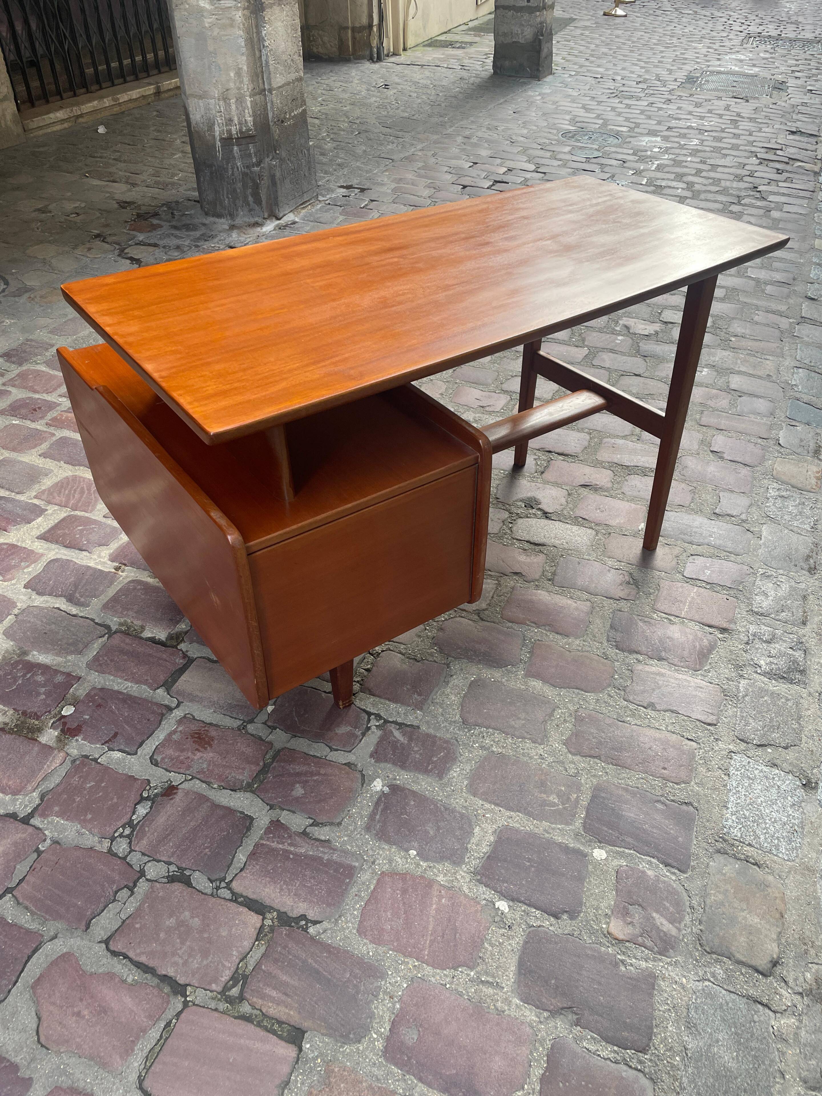Mahogany desk with drawers by Jacques Hauville published by Bema.