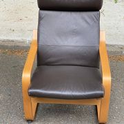 Scandinavian rocking chair in curved wood and brown leather from IKEA Poang