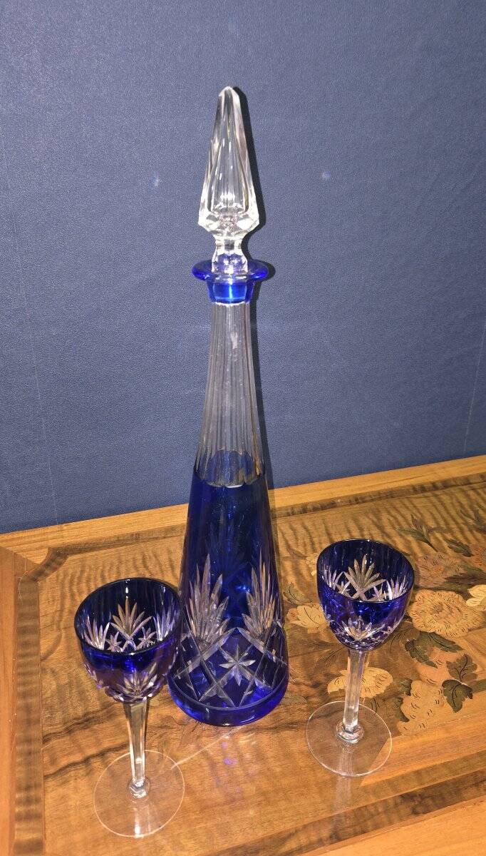 Cobalt blue double crystal service, consisting of a decanter and two matching glasses.