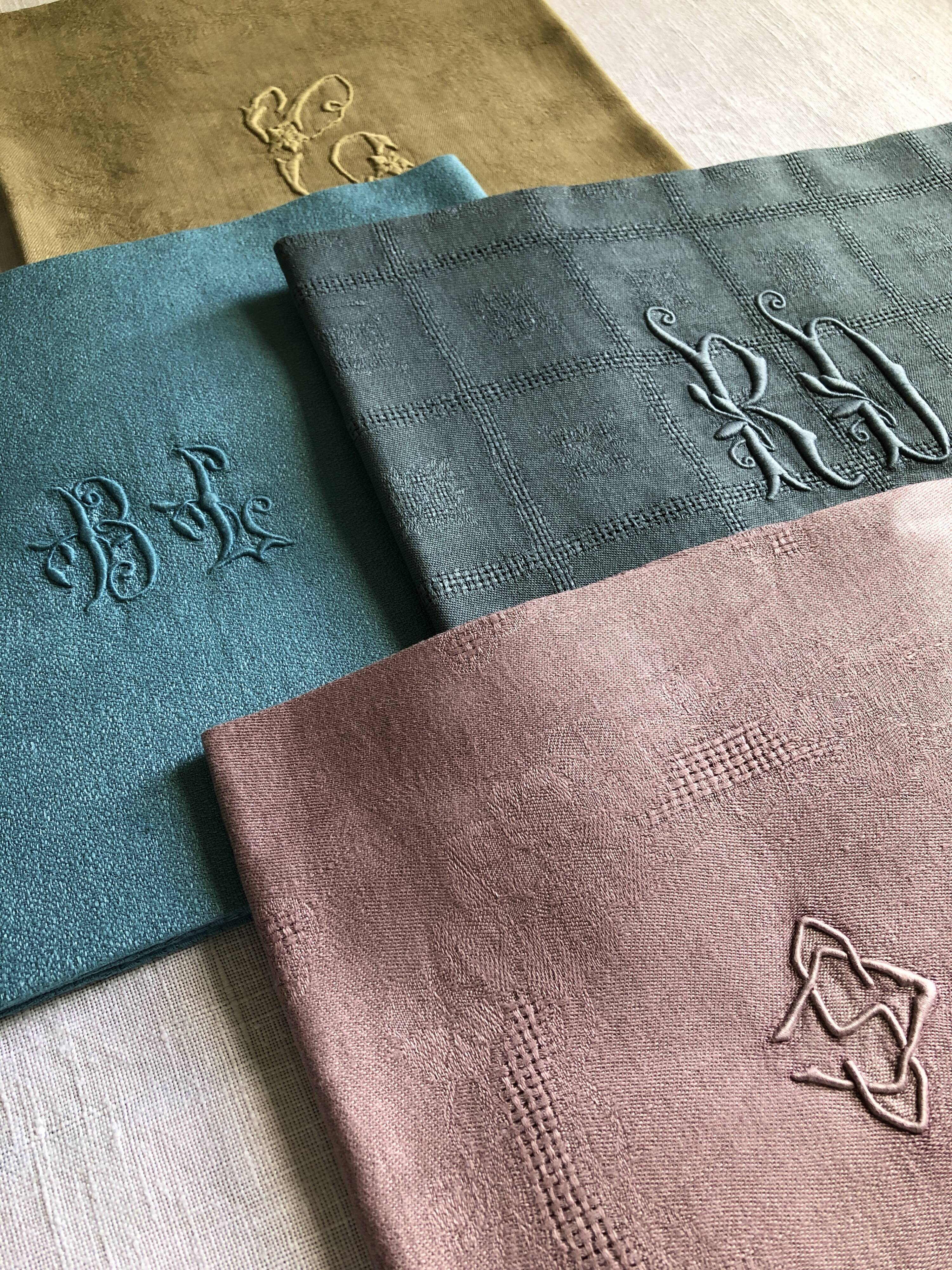 Suite of four tinted antique napkins