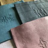 Suite of four tinted antique napkins