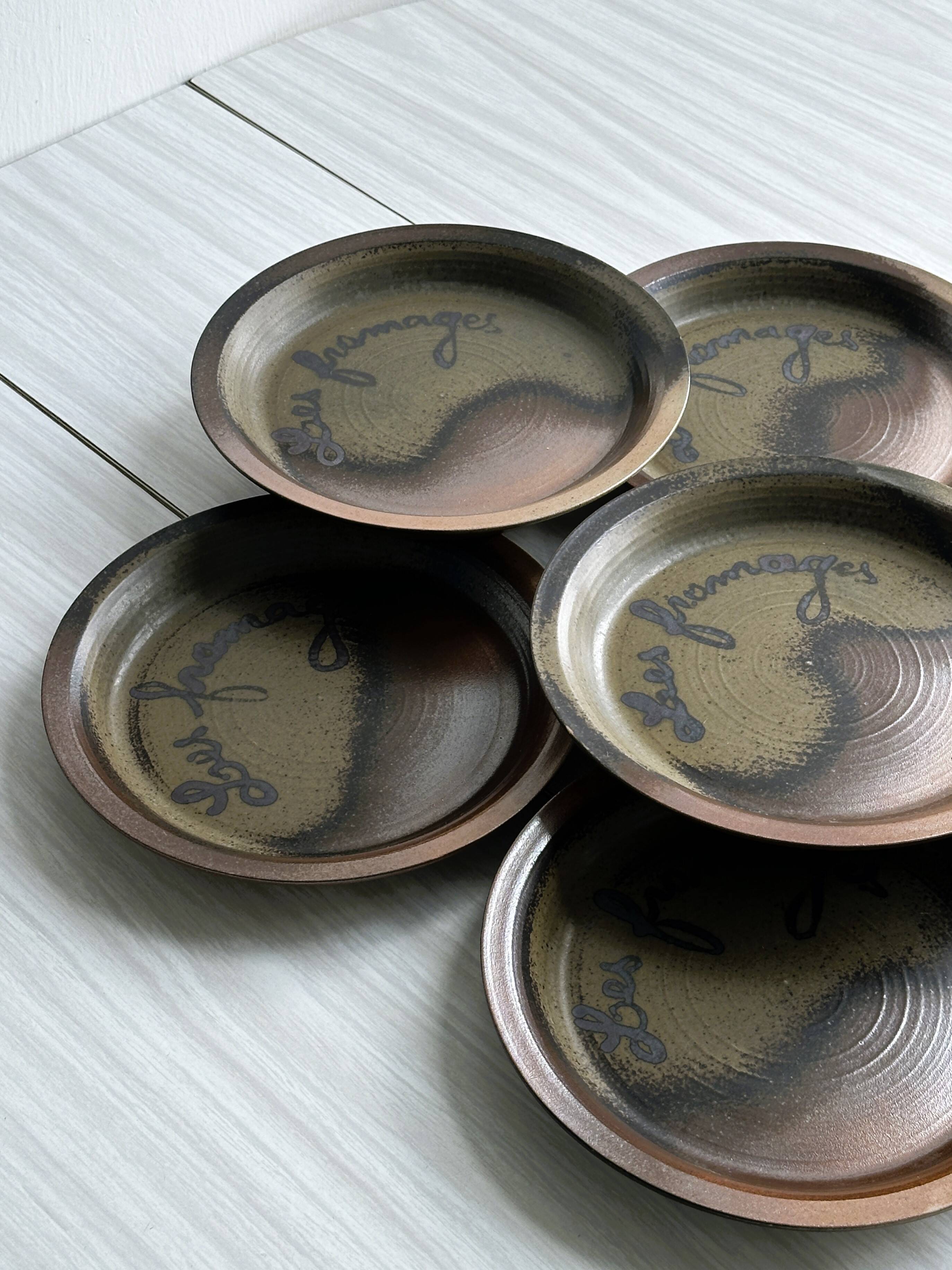 6 Arnon stoneware cheese plates.