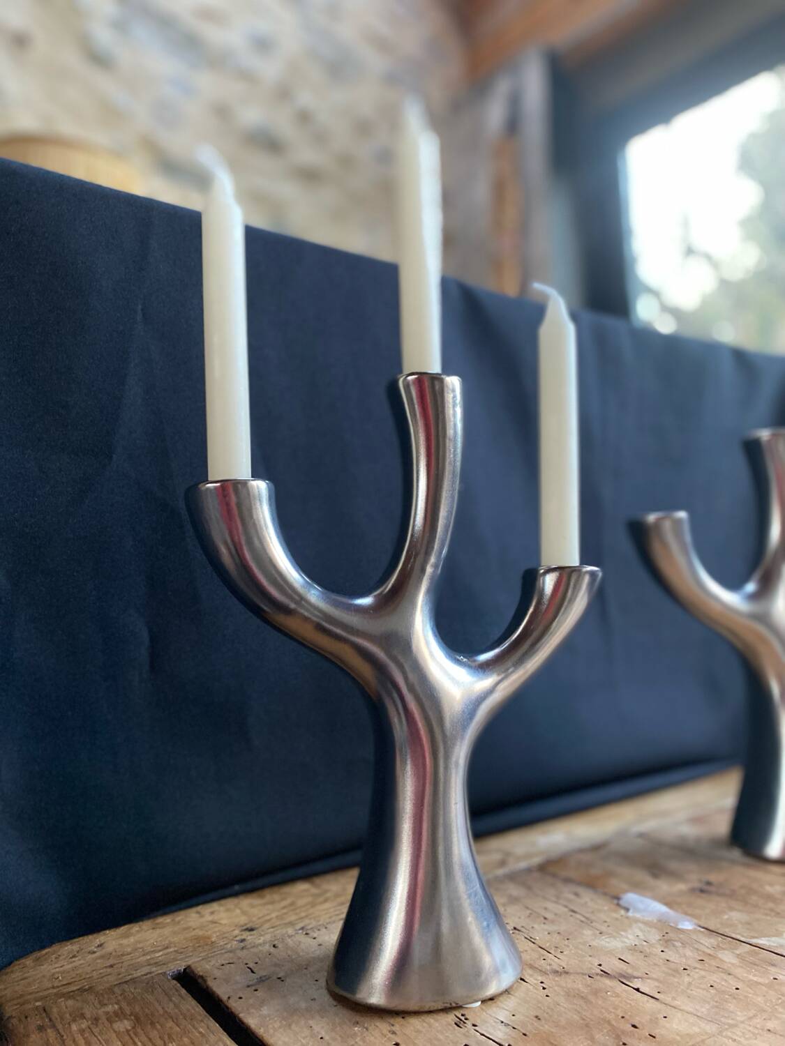 Silver candlesticks in the shape of a 3-branch tree
