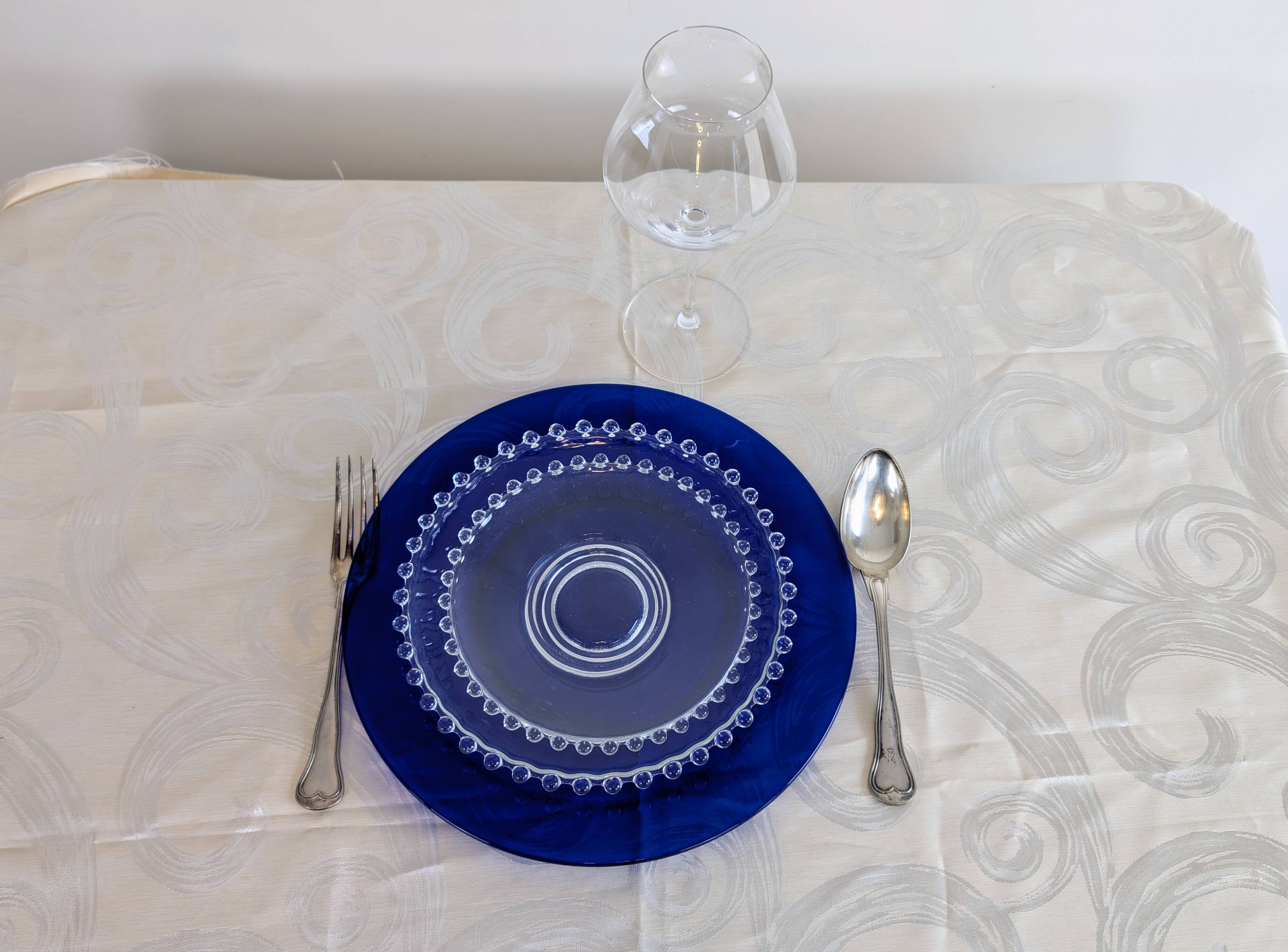 Vintage service of 12 pressed glass plates with bead decoration.