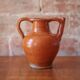 Ancient Orjol jug in orange glazed terracotta from South West France, 19th century.