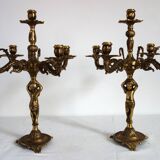 Pair of cherub candle holders in gilded bronze, early 20th century.