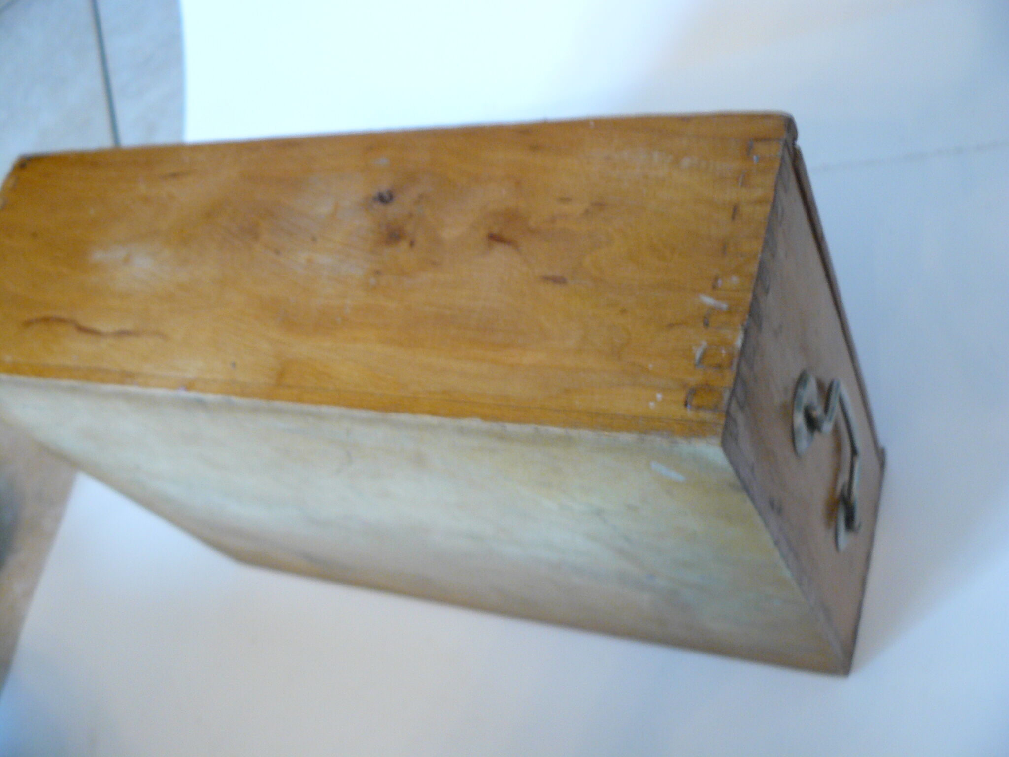 Wooden storage box marked "with a golden hammer"