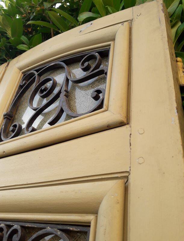 19th century double arched entrance door in oak with grilles and old glass