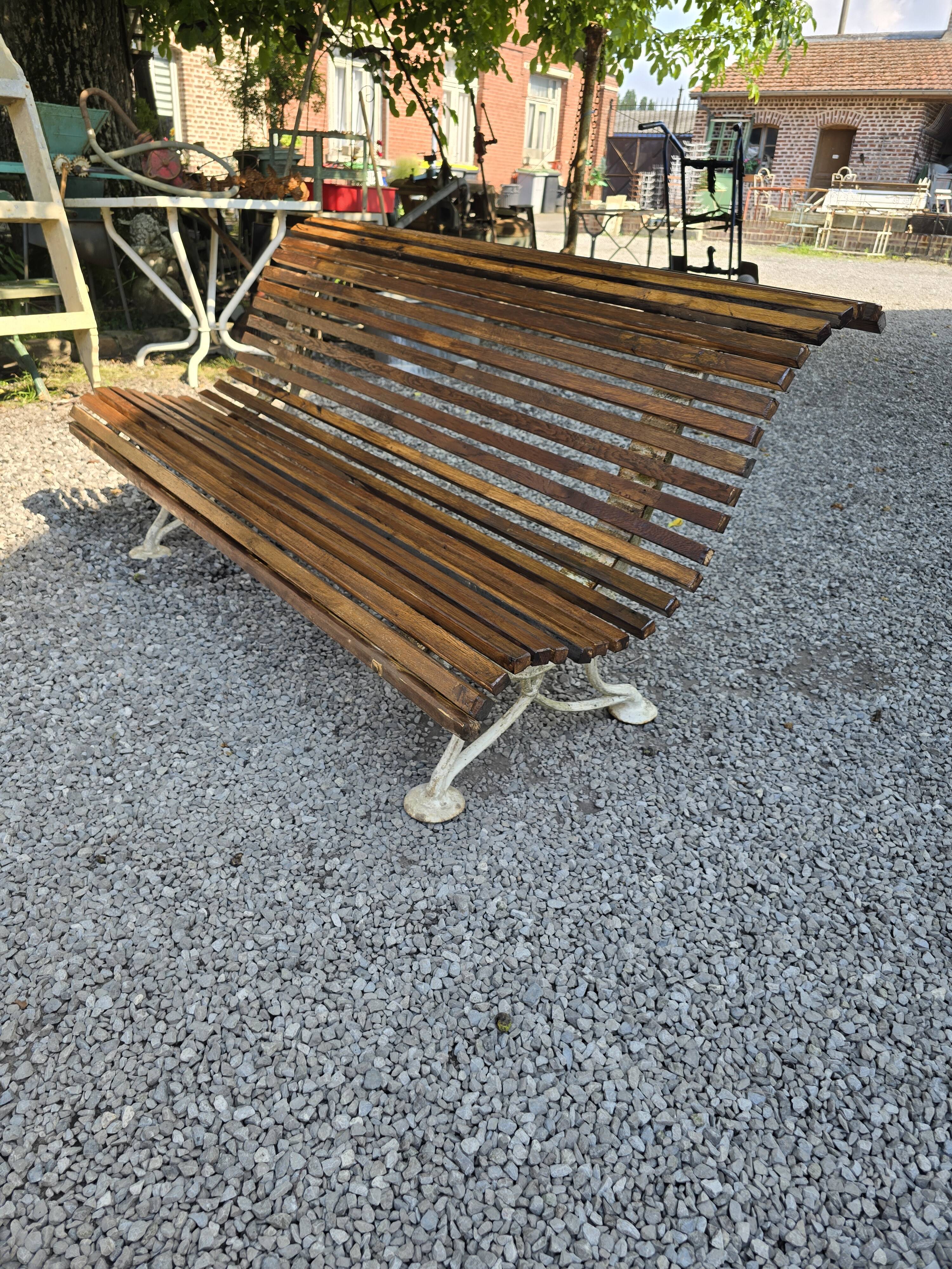 Garden bench with cast iron legs and oak slats