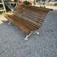 Garden bench with cast iron legs and oak slats