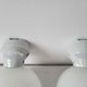 Duo of art deco wall lamps in porcelain and opaline