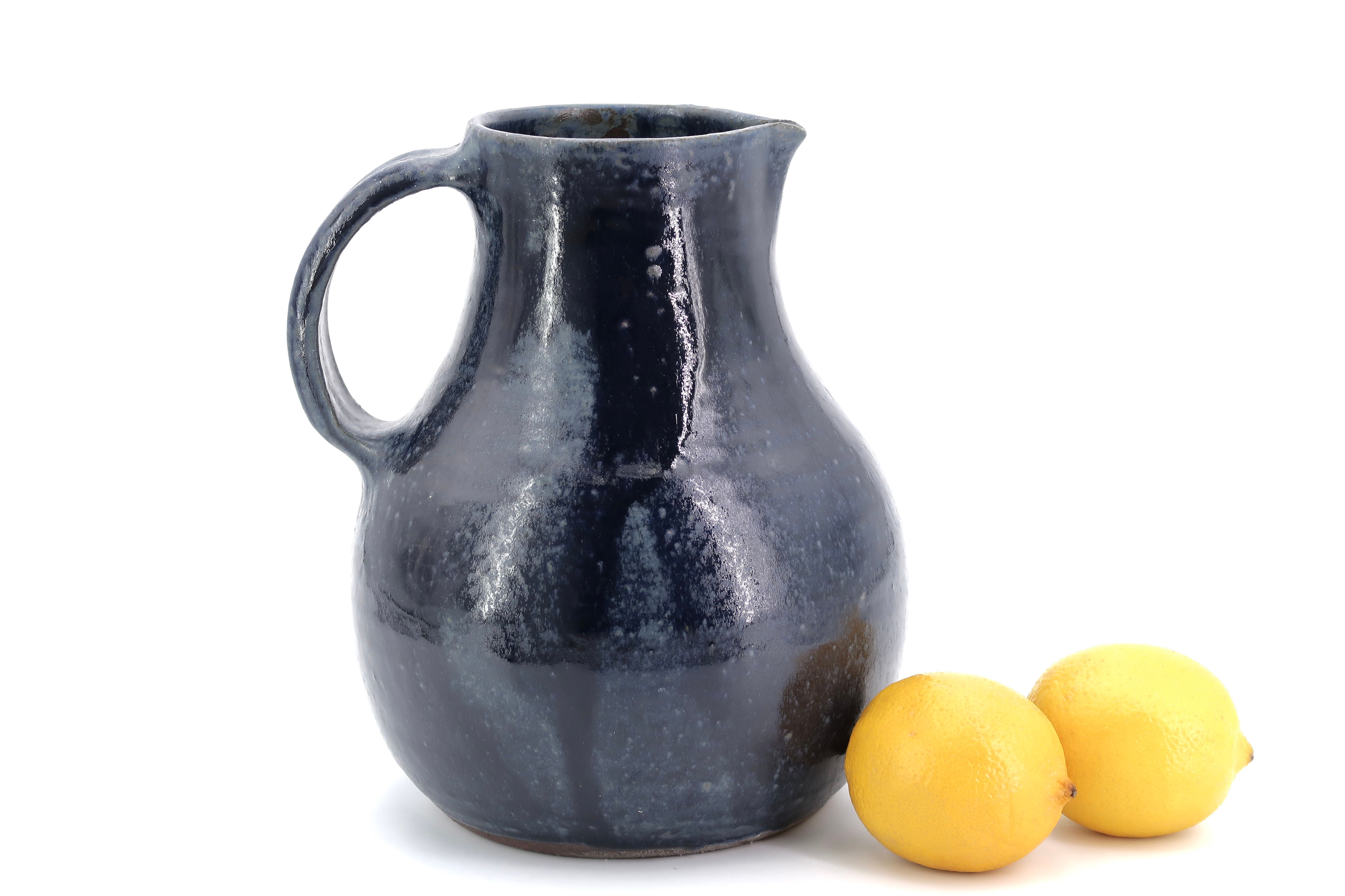 Midnight blue pitcher in sandstone by Jeanne and Norbert Pierlot