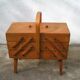 Worker sewing box feet compass