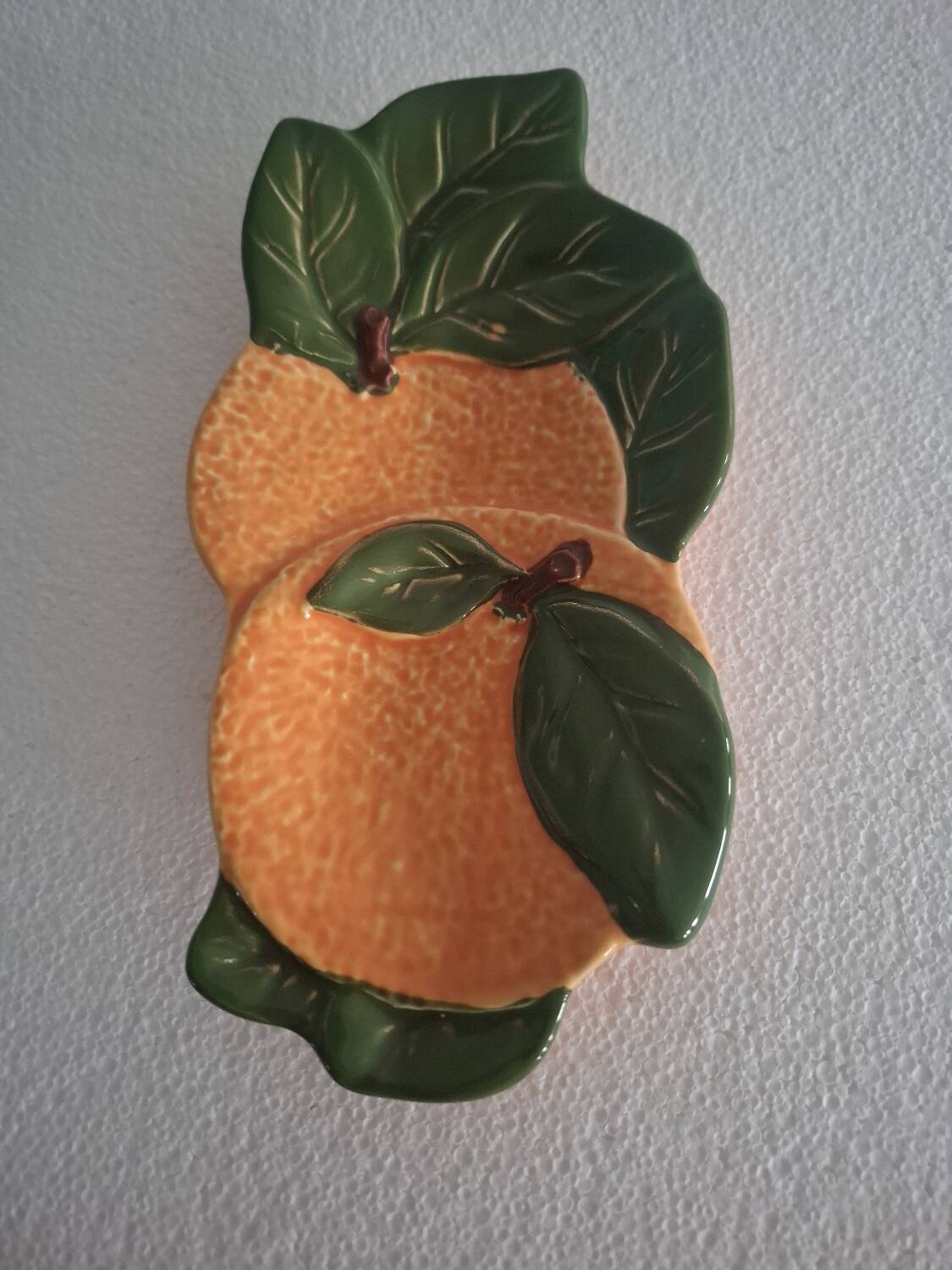 Orange trompe l'oeil slip dish.