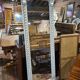 Beige patinated mirror with women's heads