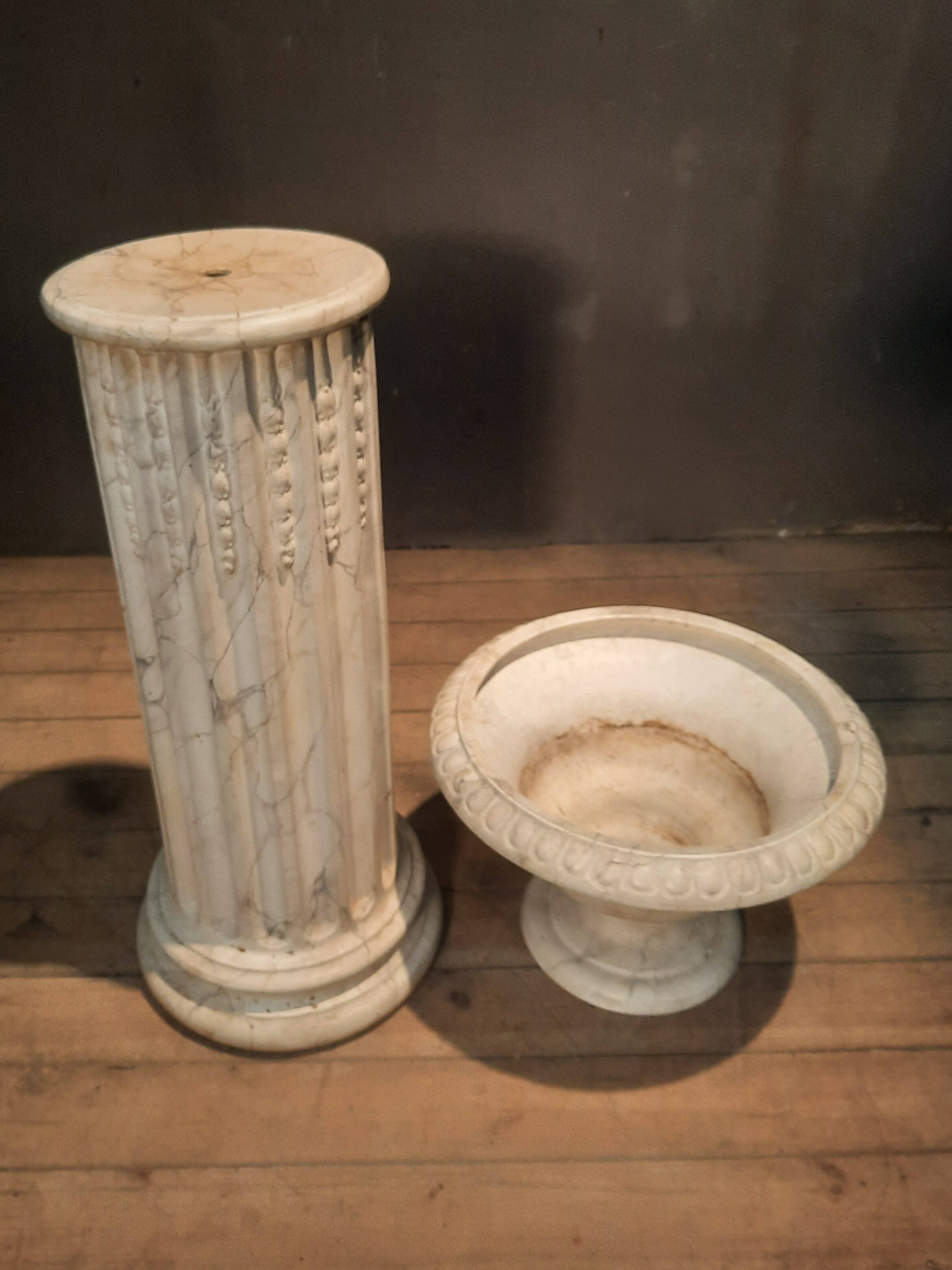 Column topped with a plaster basin.