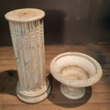 Column topped with a plaster basin.