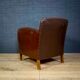 Antique club armchair of leather cloth