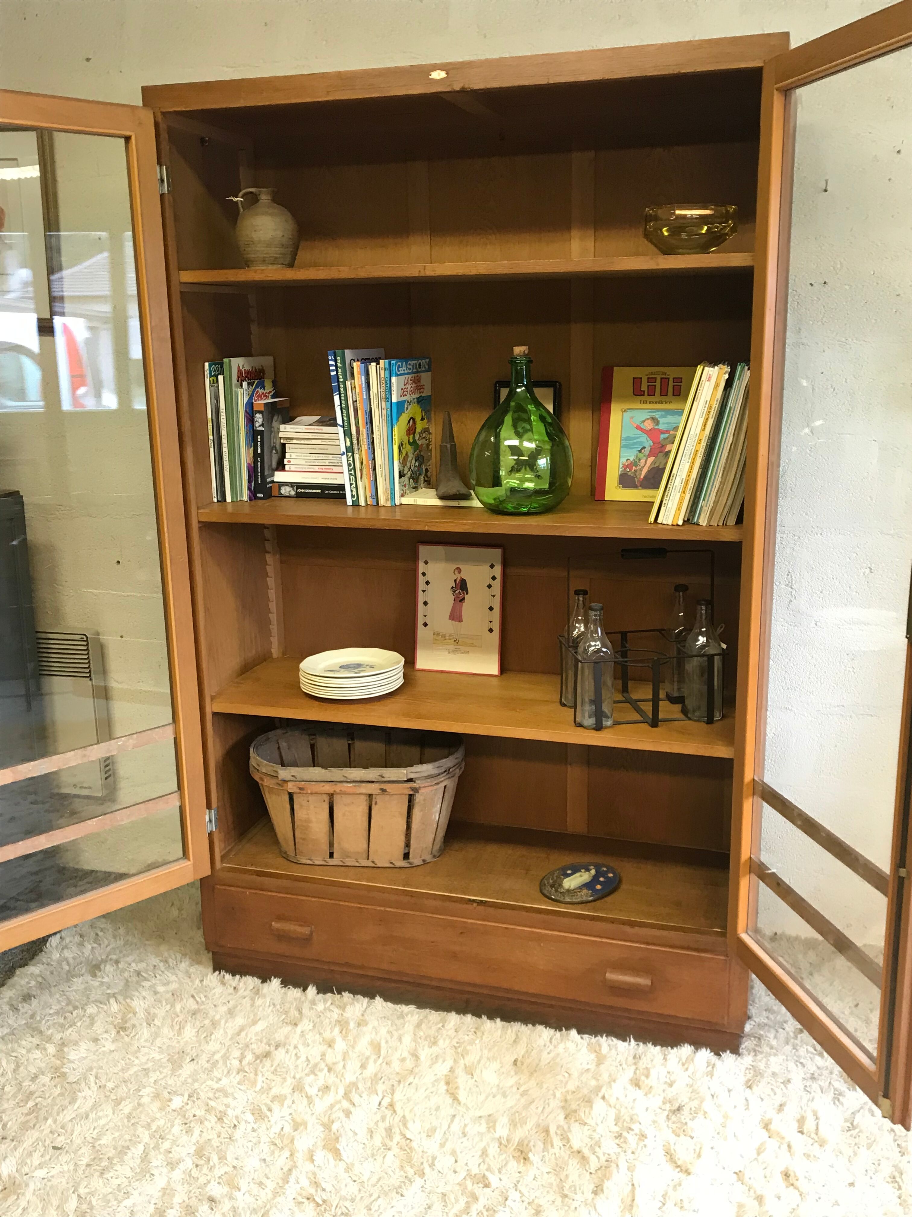 Old school glass bookcase in blond wood