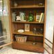 Old school glass bookcase in blond wood